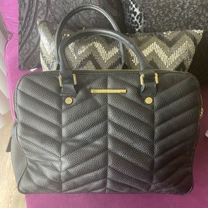 Black and gold Steve Madden purse